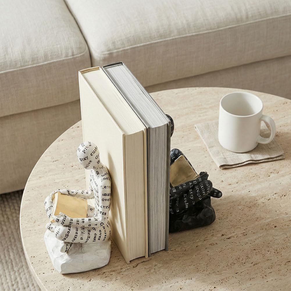 Thinker bookends styled on a warm oak sideboard with fluted panel wall and cotton stems